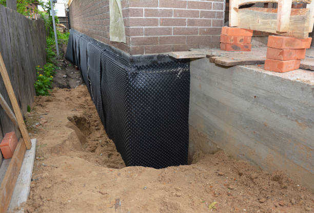 Happy homeowners after waterproofing job in Hasbrouck Heights